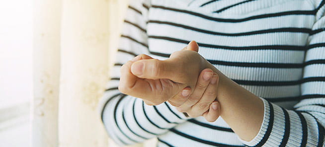 Doctor examines a patient's hand and wrist